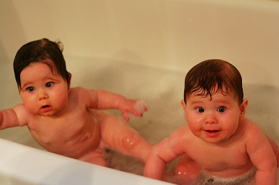 Babies' first bath together
