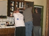 How many men does it take to install a microwave?