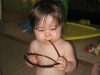 Ella playing with Erica\'s sunglasses